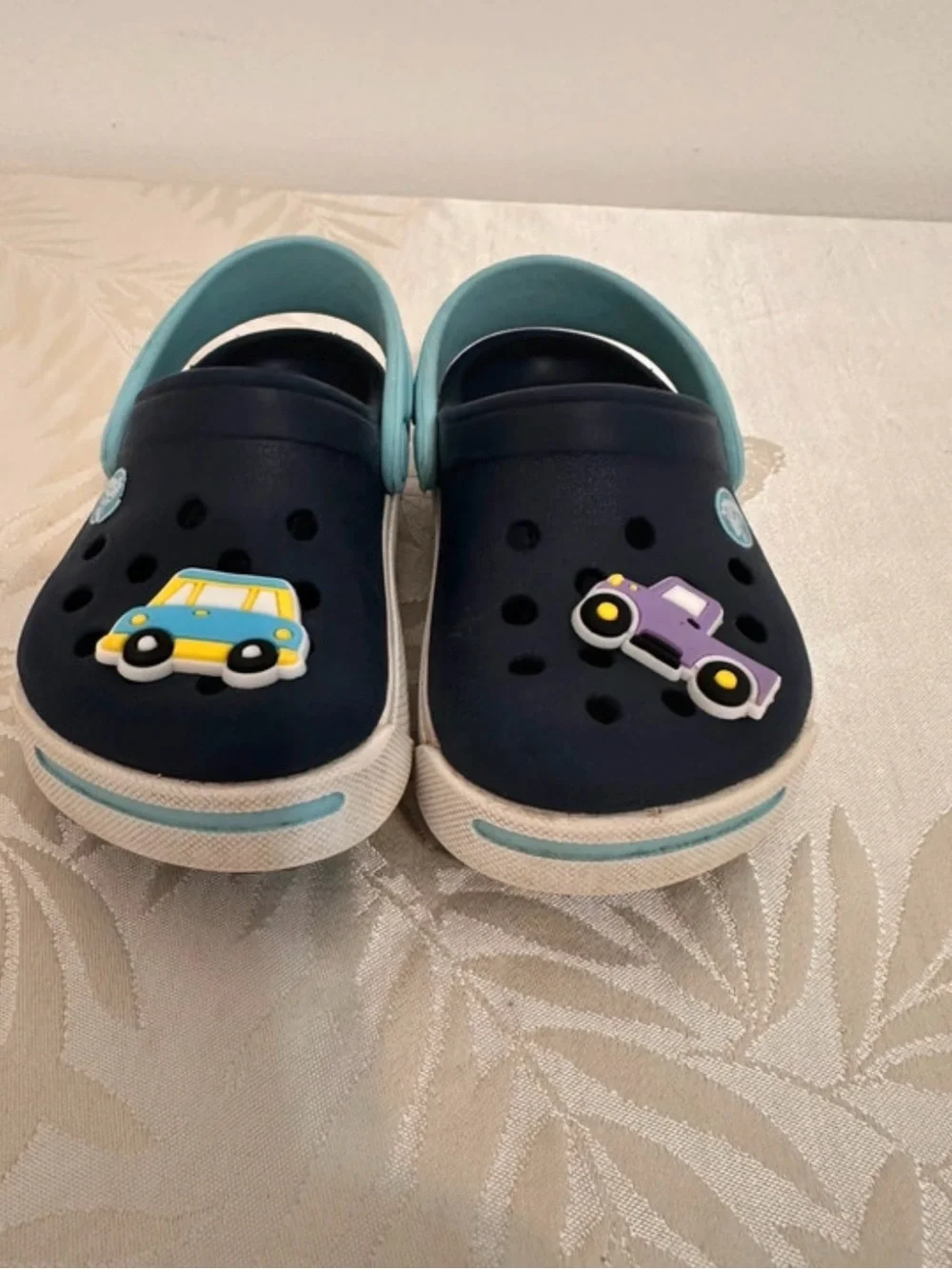 CROCS Navy Clogs with Light Blue Heel Straps and Car Charms